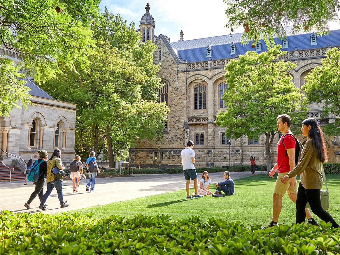 Students walking along Goodman Crescent on campus